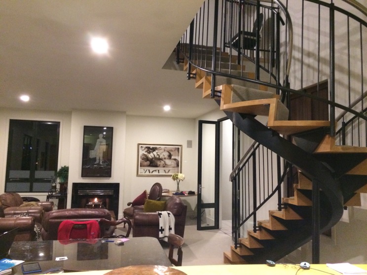 The lounge and stairs, taken from the kitchen.